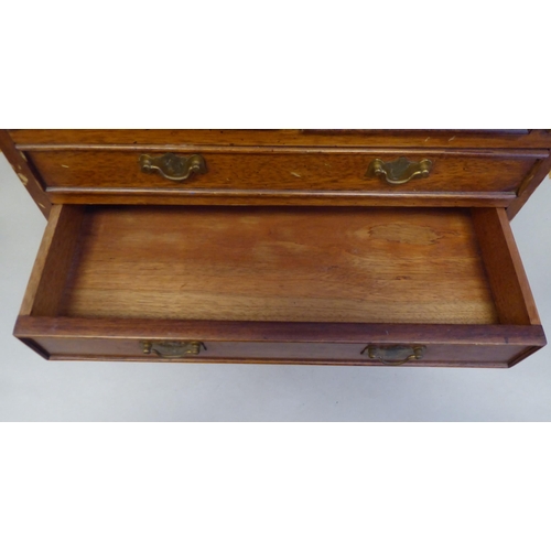 9 - A modern Korean teak Georgian style bureau, in the manner of a trader's sample with brass fittings  ... 