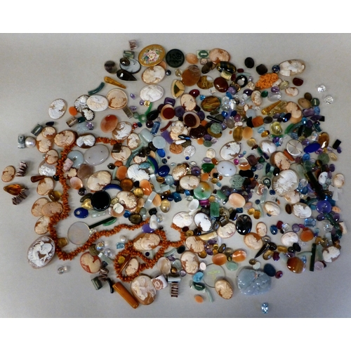 127 - Items of personal ornament: to include loose coloured stones; coral fragments; and unmounted cameos