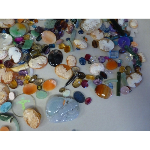 127 - Items of personal ornament: to include loose coloured stones; coral fragments; and unmounted cameos