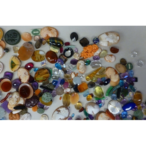 127 - Items of personal ornament: to include loose coloured stones; coral fragments; and unmounted cameos