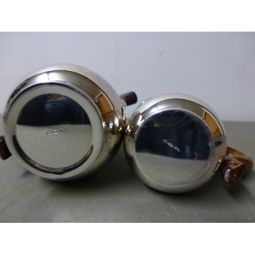 146 - A white metal coffee pot with a wooden handle; and cream jugs&nbsp; stamped 800&nbsp; (approx. combi... 