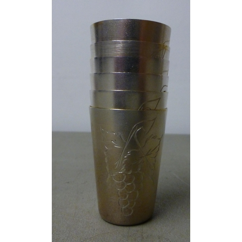 146 - A white metal coffee pot with a wooden handle; and cream jugs&nbsp; stamped 800&nbsp; (approx. combi... 