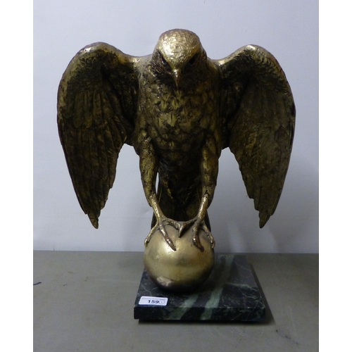 159 - A modern gilded composition bald eagle, on a ball finial and marble effect plinth  15