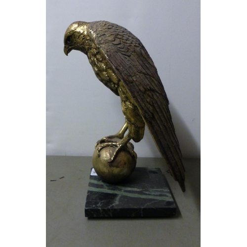 159 - A modern gilded composition bald eagle, on a ball finial and marble effect plinth  15