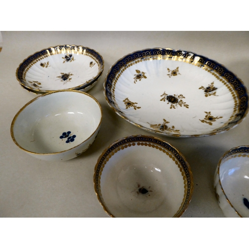 165 - Late 18thC Caughley porcelain teaware, decorated in gilded blue and white with floral sprigs and oth... 