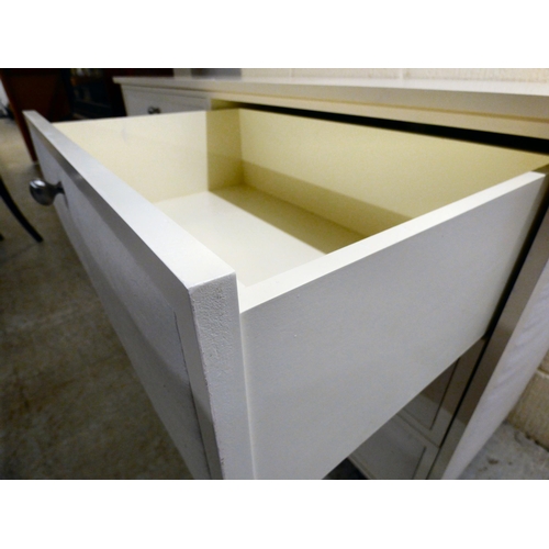 170 - A modern white painted dressing chest with six drawers, each covered with a fabric panel front, rais... 