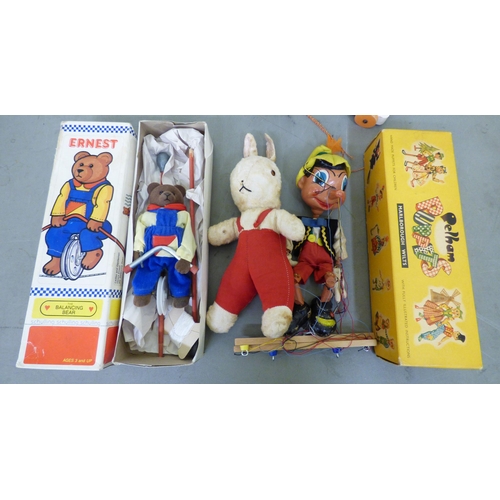 180 - Vintage toys: to include 'Ernest the Balancing Bear'; marbles and a Pelham puppet 'Pinocchio'