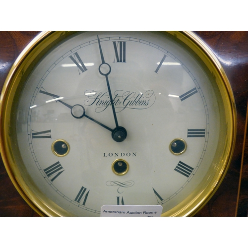 32 - A modern reproduction of a Georgian mahogany mantel timepiece by Knight & Gibbins of London; the... 