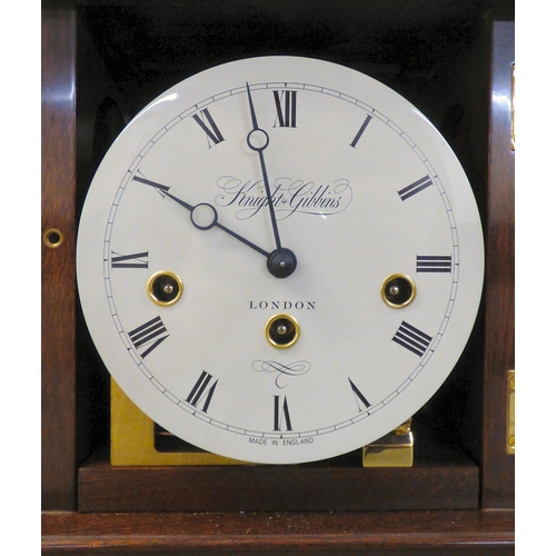32 - A modern reproduction of a Georgian mahogany mantel timepiece by Knight & Gibbins of London; the... 
