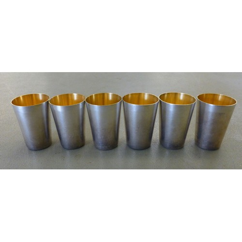 145 - Six silver gilt tot cups  stamped 875  (combined gross weight 140grms)