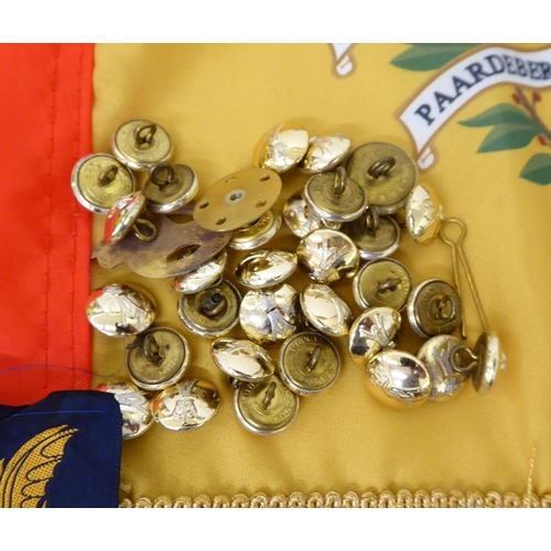 28 - Mainly Hampshire related militaria: to include a bayonet; printed sash; badges; buttons; and similar... 