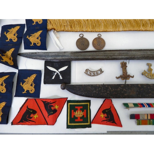 28 - Mainly Hampshire related militaria: to include a bayonet; printed sash; badges; buttons; and similar... 
