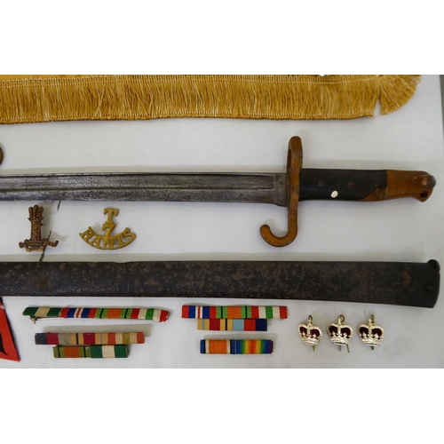28 - Mainly Hampshire related militaria: to include a bayonet; printed sash; badges; buttons; and similar... 