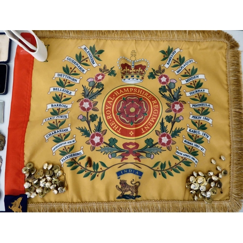 28 - Mainly Hampshire related militaria: to include a bayonet; printed sash; badges; buttons; and similar... 