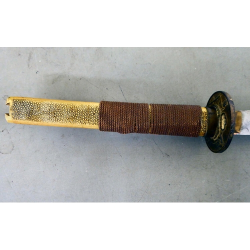 29 - A Japanese kutana with a simulated shagreen effect grip, cast metal tsuba and 29