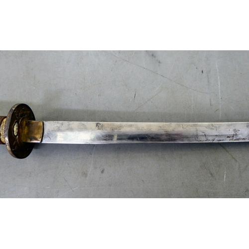 29 - A Japanese kutana with a simulated shagreen effect grip, cast metal tsuba and 29