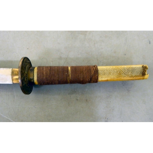29 - A Japanese kutana with a simulated shagreen effect grip, cast metal tsuba and 29