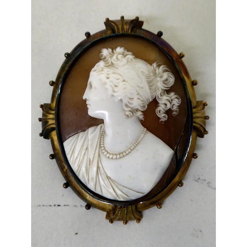 55 - A late Victorian decorative and later gilt metal framed cameo brooch