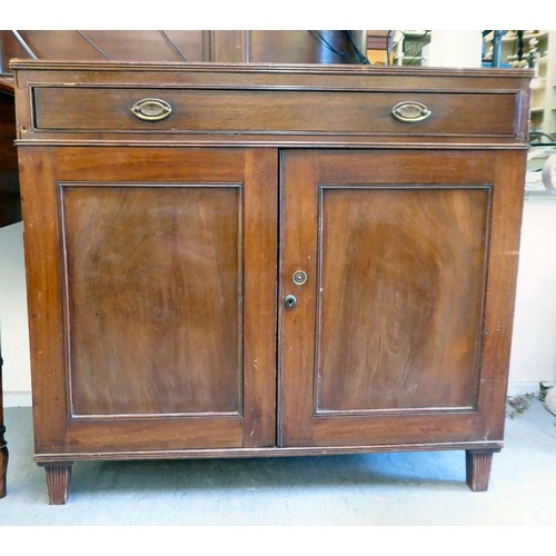 27 - An early/mid 19thC mahogany side cabinet with a frieze drawer, over a pair of panelled doors, raised... 
