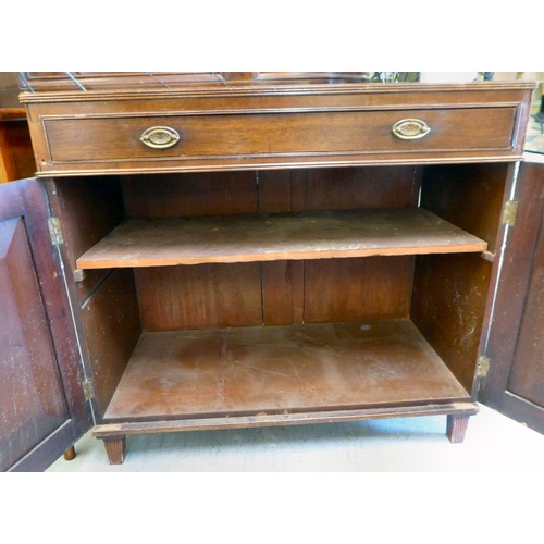 27 - An early/mid 19thC mahogany side cabinet with a frieze drawer, over a pair of panelled doors, raised... 