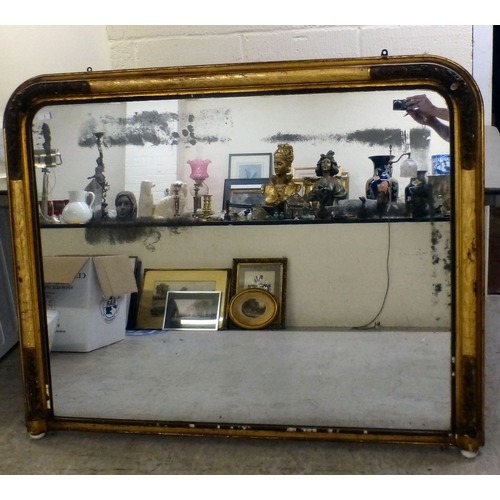 1 - A 19thC overmantel mirror, the shaped plate set in a floral decorated, moulded gilt frame  42