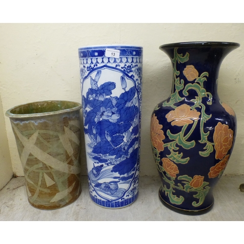 13 - Interior designer accessories: to include a modern china, cylindrical stickstand, decorated in blue ... 