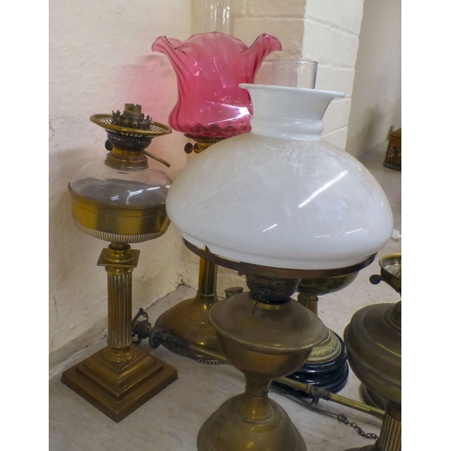 19 - Interior lighting: to include early 20thC oil lamps (converted to electricity)&nbsp; largest 26
