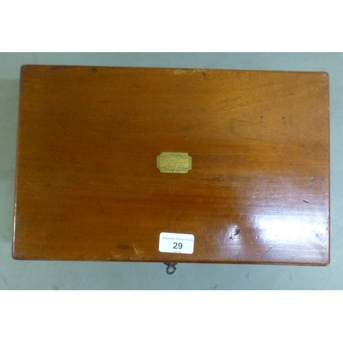 29 - A late Victorian mahogany physician/doctor's box with a hinged lid and two drawers, containing medic... 