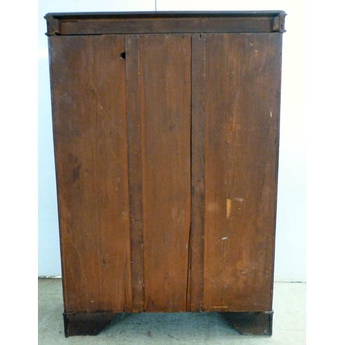 3 - An early 20thC mahogany two door cabinet, enclosing two shelves, over three in-line drawers, raised ... 
