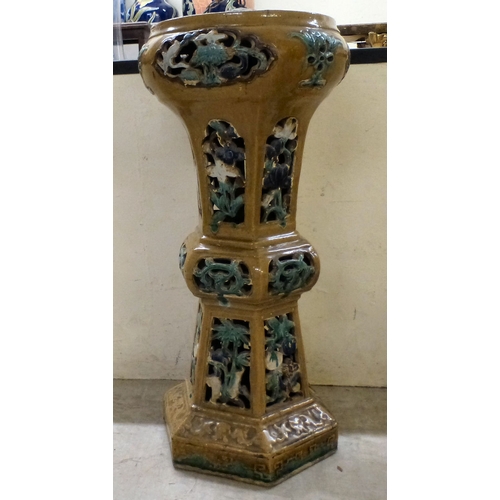 52 - A 20thC Chinese inspired pottery jardini&egrave;re with pierced and painted features&nbsp; 30