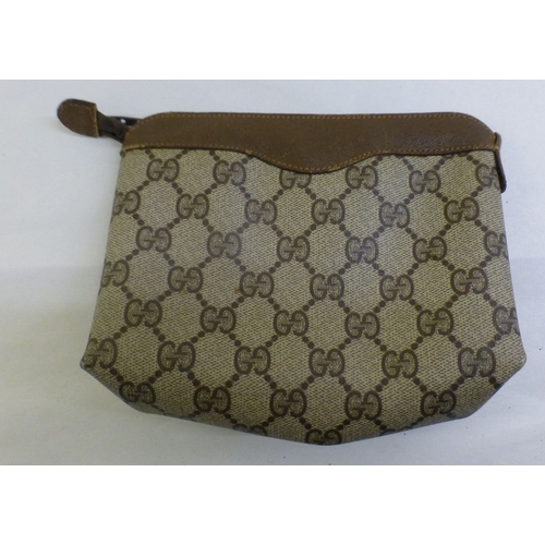 59 - A Gucci brown leather and fabric makeup bag   no.62402  6