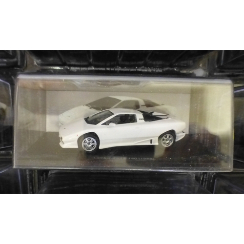 Approx. thirty-two cased model vehicles, various makes and scales: to ...