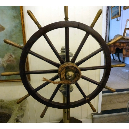 121 - A reproduction of a ships wheel, mounted on a brass column&nbsp; 60