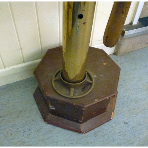 121 - A reproduction of a ships wheel, mounted on a brass column&nbsp; 60