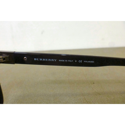 128 - Three pairs of sunglasses: to include a pair by Burberry  cased