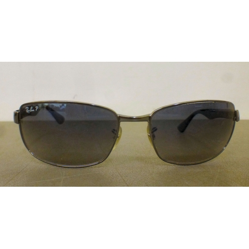 128 - Three pairs of sunglasses: to include a pair by Burberry  cased