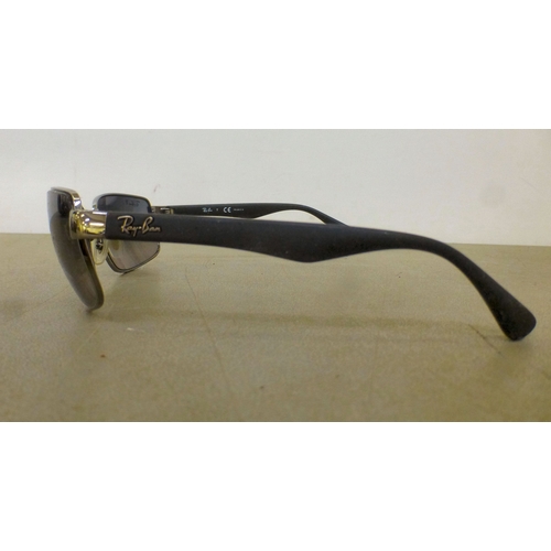 128 - Three pairs of sunglasses: to include a pair by Burberry  cased