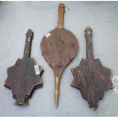 148 - Three Baronial style oak framed, ornately decorated bellows  largest 60