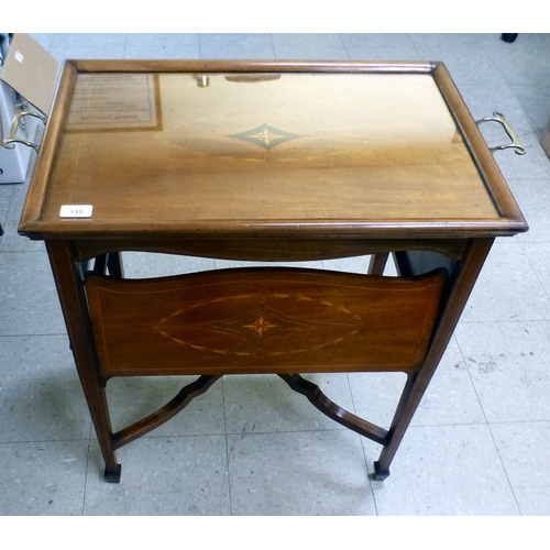 155 - An Edwardian string inlaid mahogany serving table, the detachable glazed tray raised on four folding... 