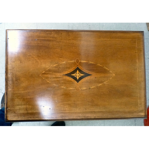 155 - An Edwardian string inlaid mahogany serving table, the detachable glazed tray raised on four folding... 