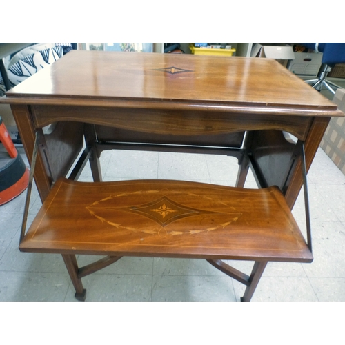 155 - An Edwardian string inlaid mahogany serving table, the detachable glazed tray raised on four folding... 