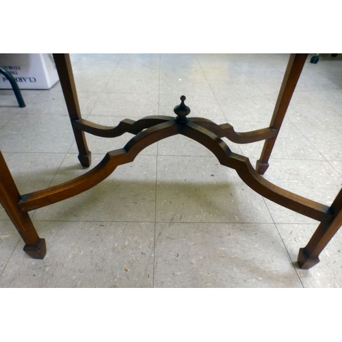 155 - An Edwardian string inlaid mahogany serving table, the detachable glazed tray raised on four folding... 
