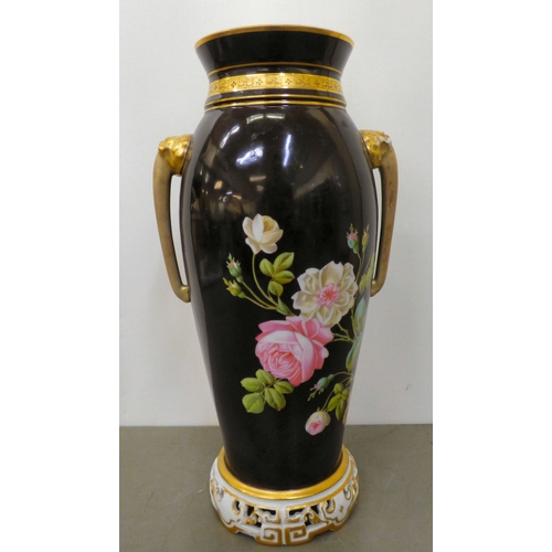163 - A late Victorian porcelain vase with opposing mask handles, decorated with roses  17