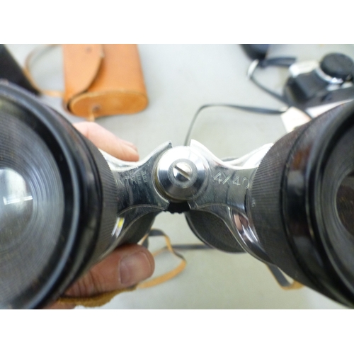 169 - Photographic and optical equipment: to include a Minolta Hi-Matic F; and a Cannon EOS 750&nbsp;