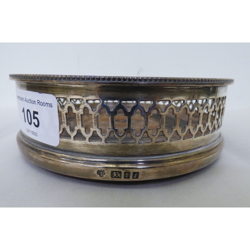 105 - Silver collectables: to include a wine bottle coaster with a turned wooden base&nbsp; indistinct Lon... 