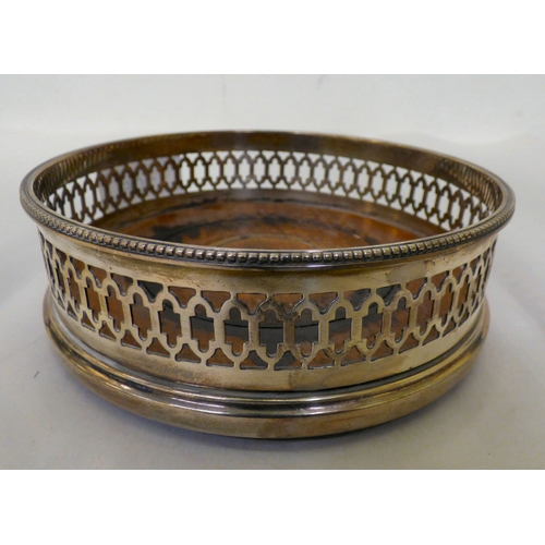 105 - Silver collectables: to include a wine bottle coaster with a turned wooden base&nbsp; indistinct Lon... 