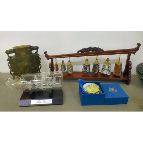 110 - A mixed lot: to include a graduated set of cloisonn&eacute; bells, in a hardwood frame&nbsp; 8