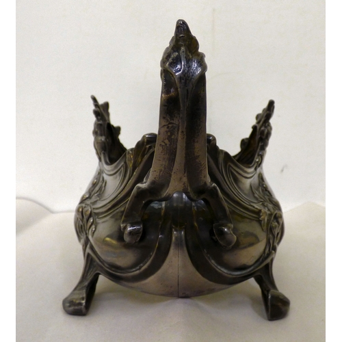 132 - An early 20thC Art Nouveau pewter dish stand, decorated with whiplash curves&nbsp; 12