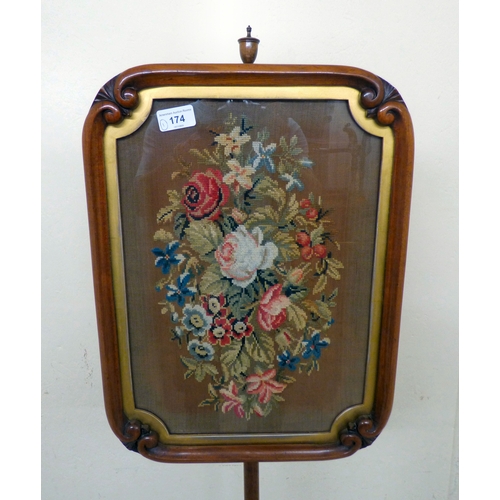 174 - A William IV mahogany polescreen with a height adjustable tapestry panel, raised on a tripod base  5... 