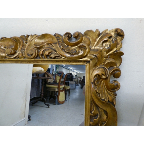 176 - A late 19thC gilt gesso framed, rococo design mirror&nbsp; 37